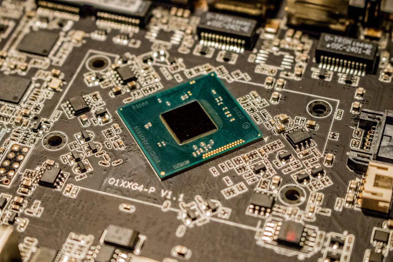 Detailed view of a microchip on a printed circuit board, showcasing electronic components.